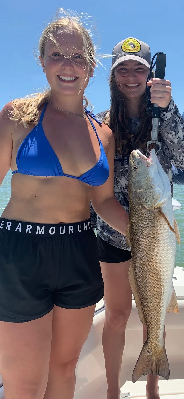 Two friends with redfish catch on Galveston Bay trip