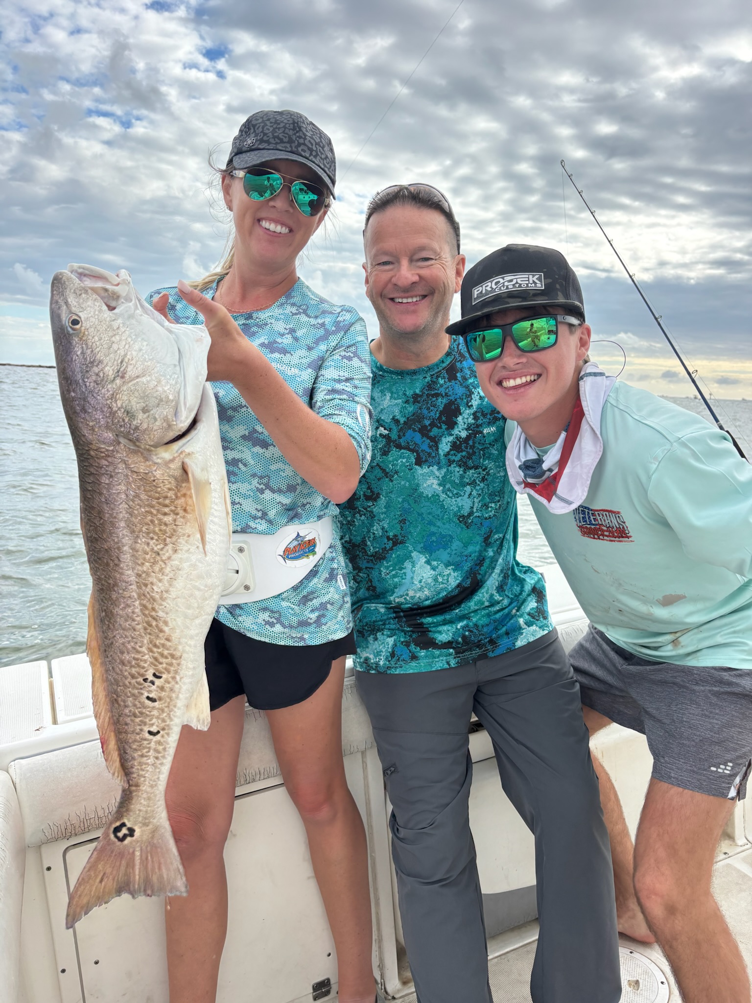 Happy group with redfish on Galveston inshore fishing trip