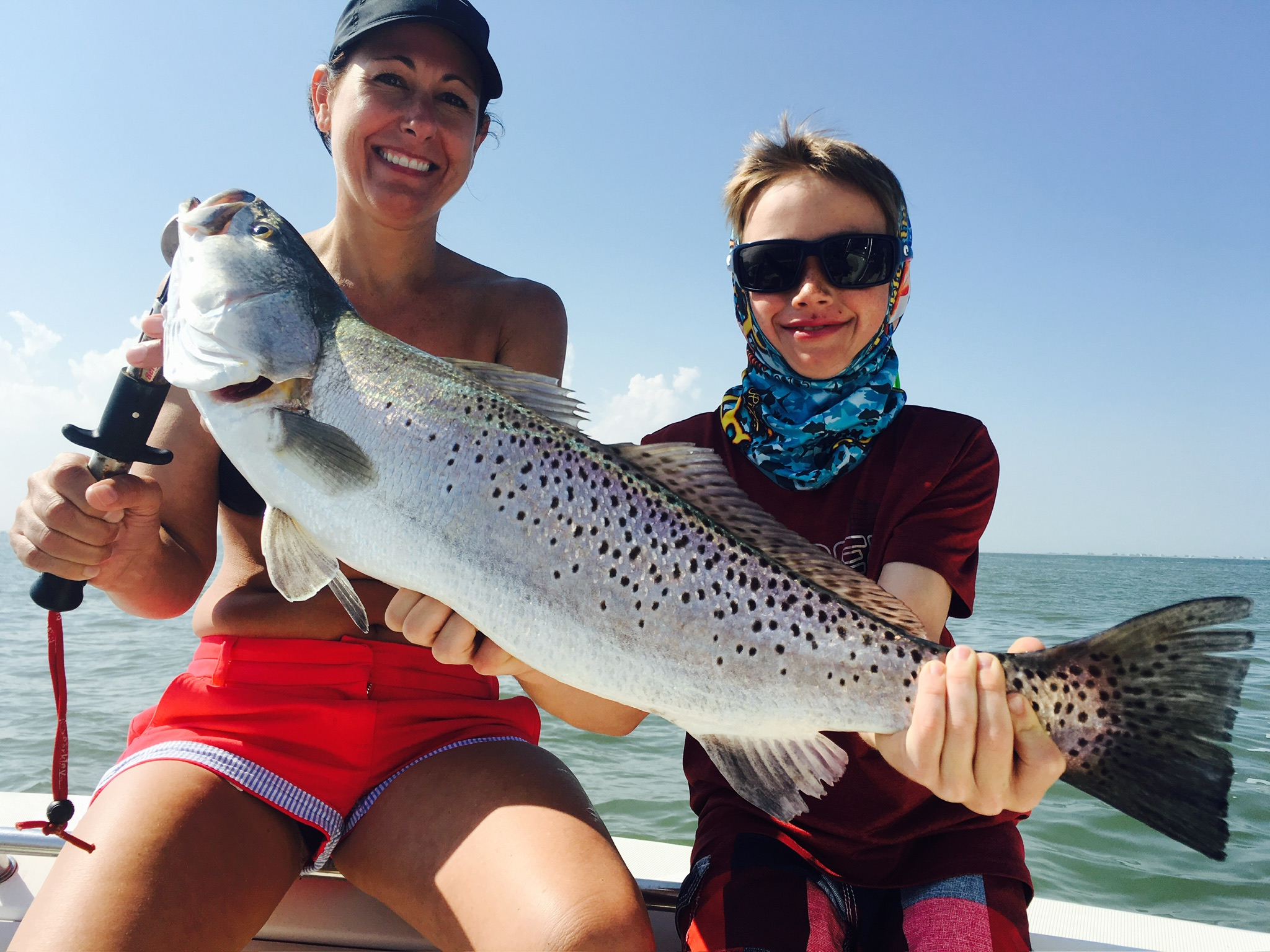 Mother and son with trout on family fishing charter Galveston